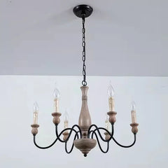 Wooden chandelier with five candle-style lights on a white background
