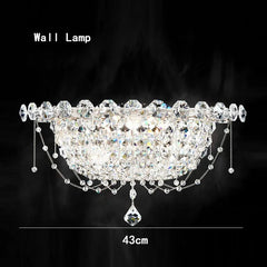 Decorative wall lamp with crystals and chains on a black background