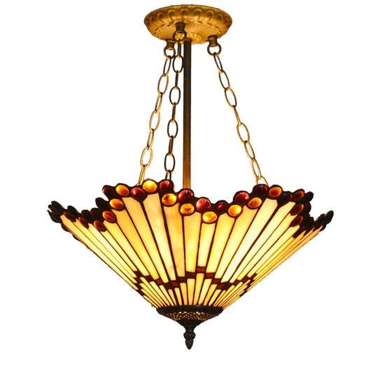 Close-up of a Tiffany-style fan pendant light with a colorful stained glass shade and a chain suspension system against a white background.