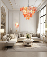 Modern living room with a stylish chandelier, sofa, and coffee table.