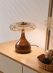 Wooden table lamp on a wooden surface with a neutral background