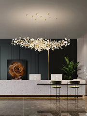 Modern interior design with a chandelier, desk, and decorative elements.