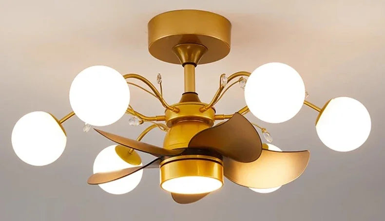 Gold ceiling fan with white lights on a neutral background