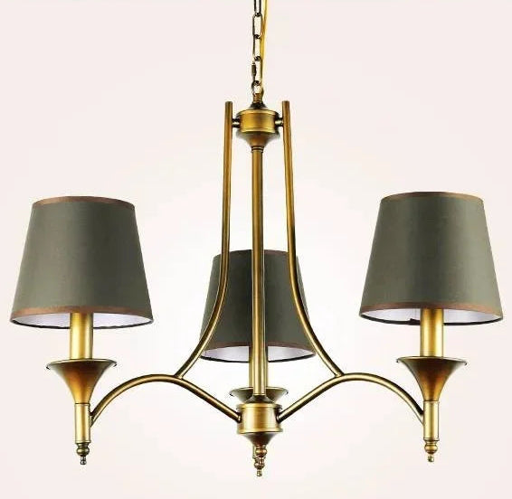 Chandelier with three green lampshades on a light pink background