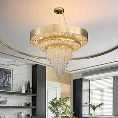 Close-up view of a gold tiered chandelier showcasing its intricate crystal design and polished gold frame.