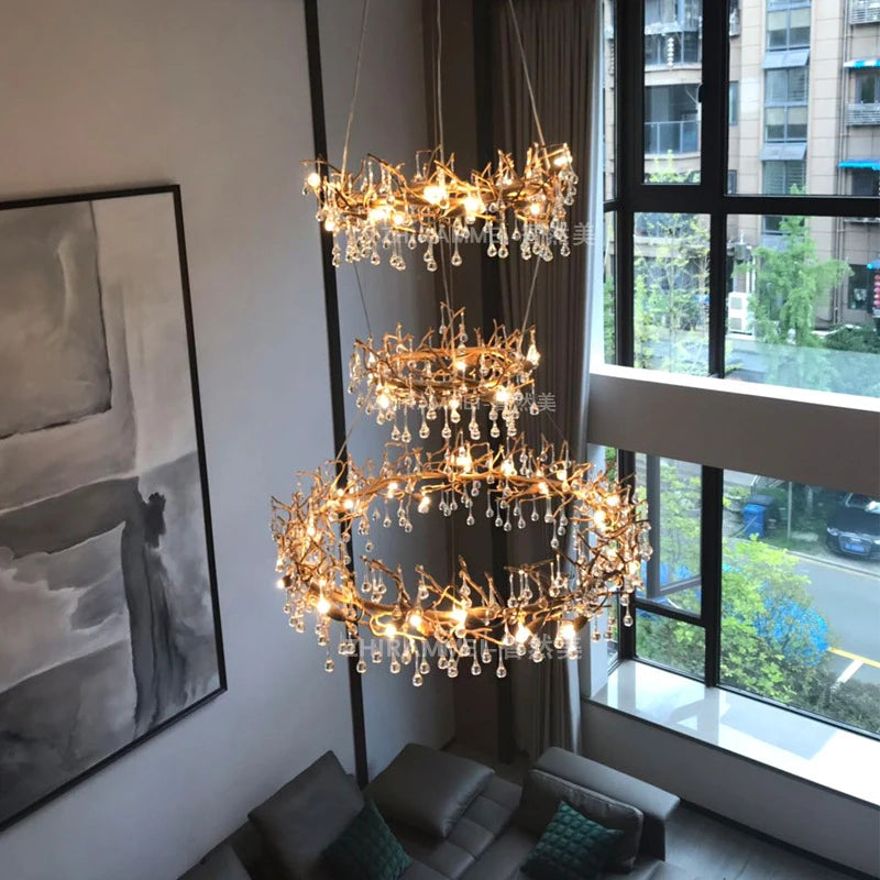 Luxurious chandelier in a modern living room with a cityscape view.