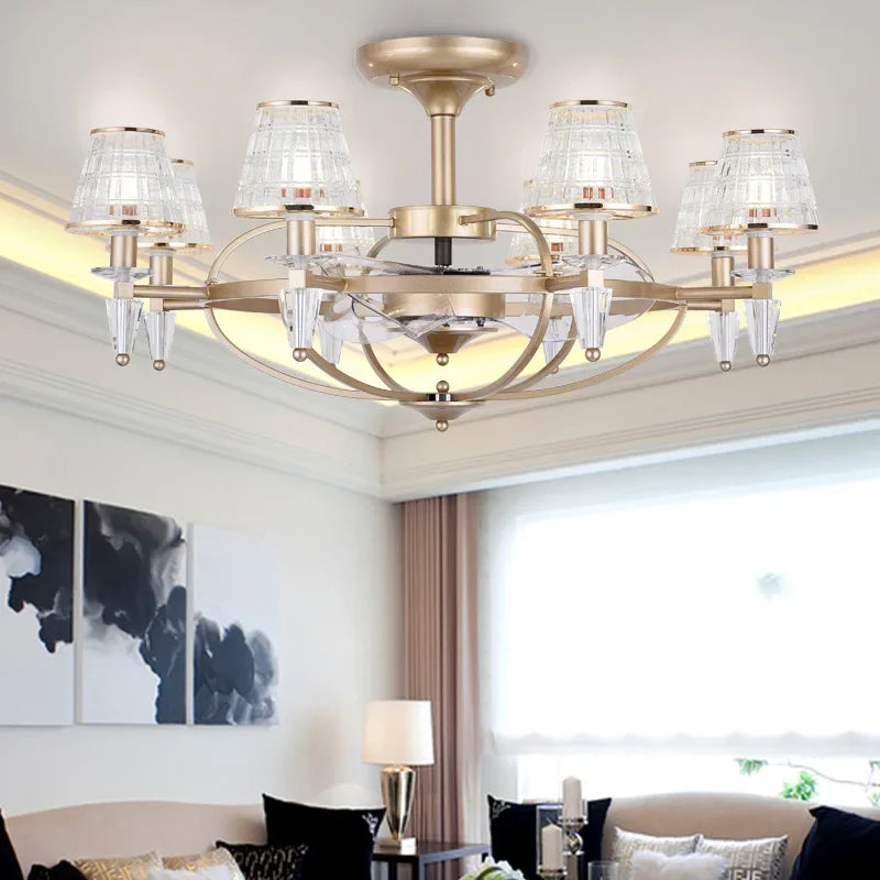 Gold chandelier in a living room setting with modern decor.