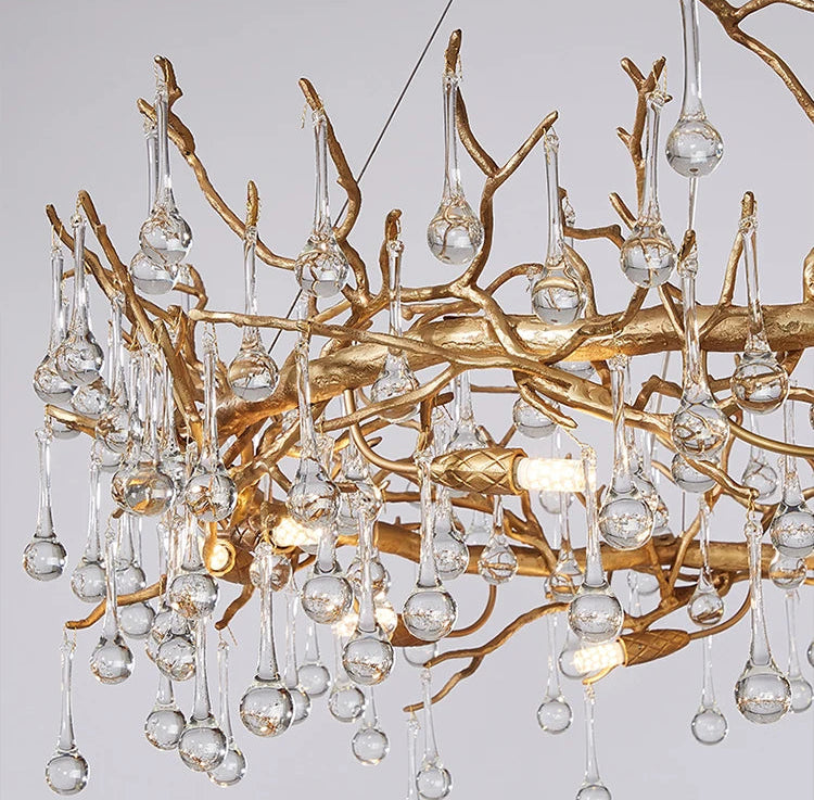 Luxury chandelier with gold branches and clear glass balls on a black background