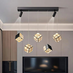 Modern ceiling light fixture with crystal-like shades in a room setting.