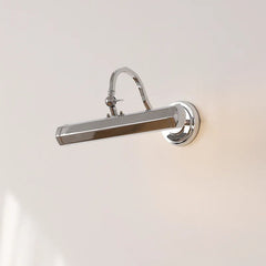 Polished chrome wall sconce with a curved arm and rectangular light head mounted on a white wall.