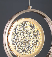 Decorative ceiling light fixture with gold and crystal design on a dark background