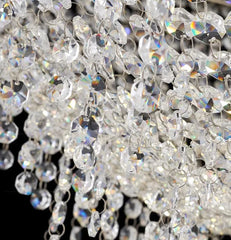 Close-up of a crystal chandelier with sparkling beads