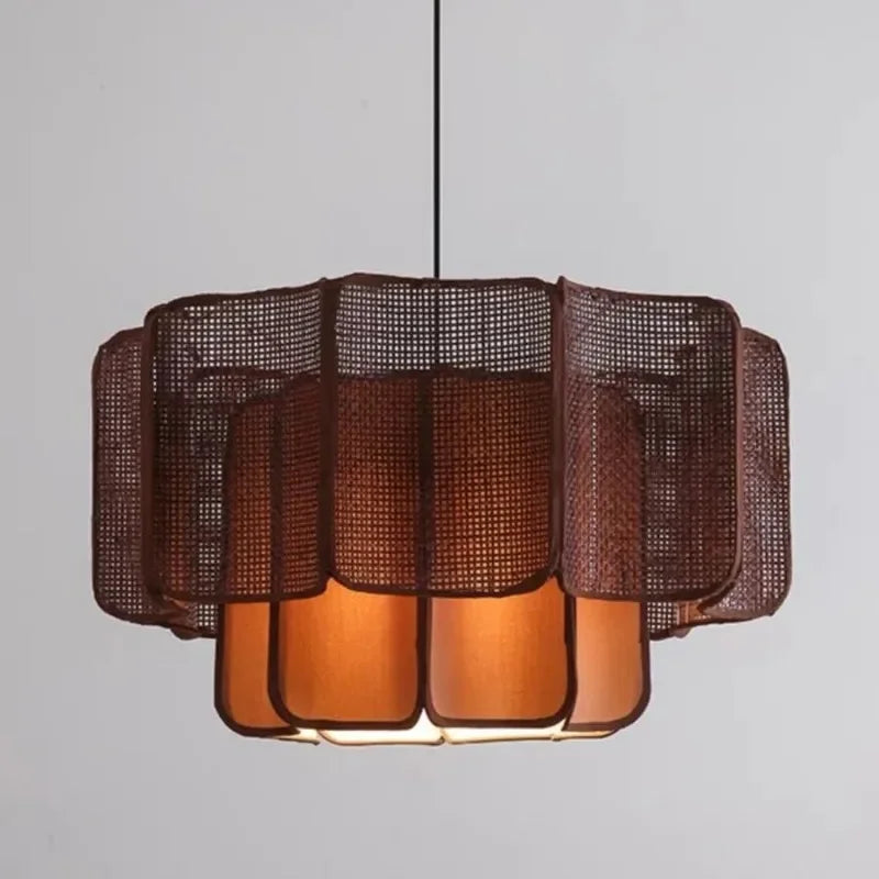 Close-up view of a dark brown rattan woven tiered pendant light, showcasing its intricate texture and layered design.