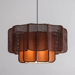 Close-up view of a dark brown rattan woven tiered pendant light, showcasing its intricate texture and layered design.