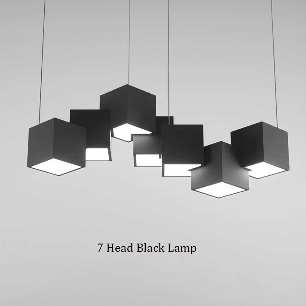 Black pendant lamp with seven cube-shaped lights on a gray background