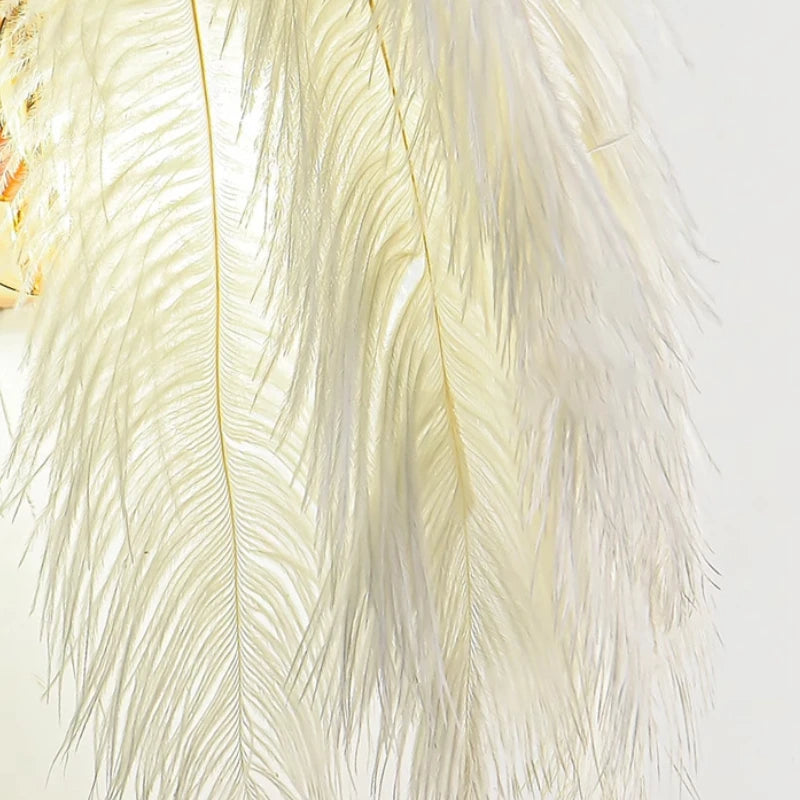 Close-up of white feathers on a light background