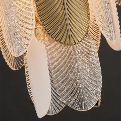 Close-up of decorative wall light fixture with gold and crystal details on a black background