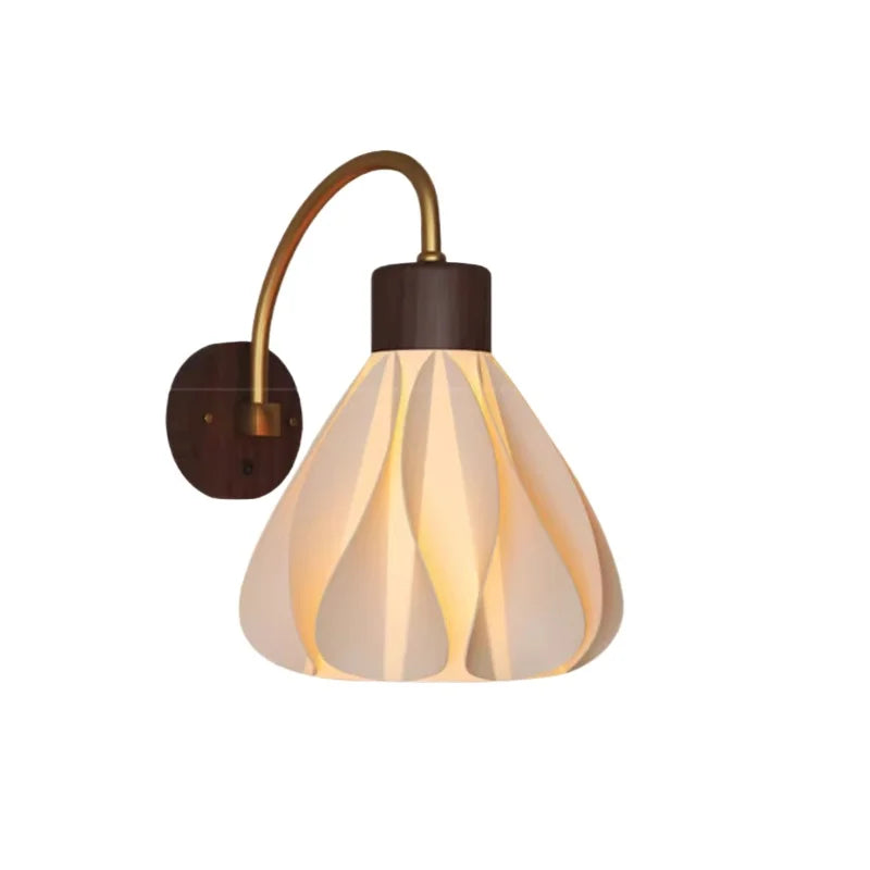 Wall-mounted lamp with decorative glass shade on a white background