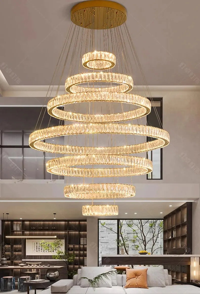 Modern chandelier hanging in a living room with a neutral color palette