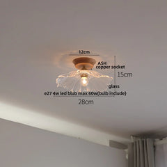 Ceiling light fixture with measurements on a white ceiling