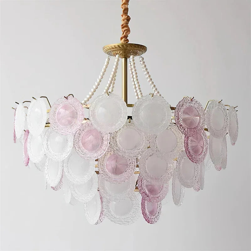 Vintage-style chandelier with pink and clear glass shades on a white background