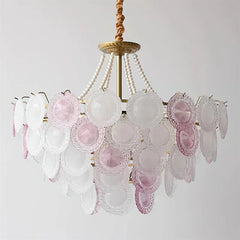 Vintage-style chandelier with pink and clear glass shades on a white background