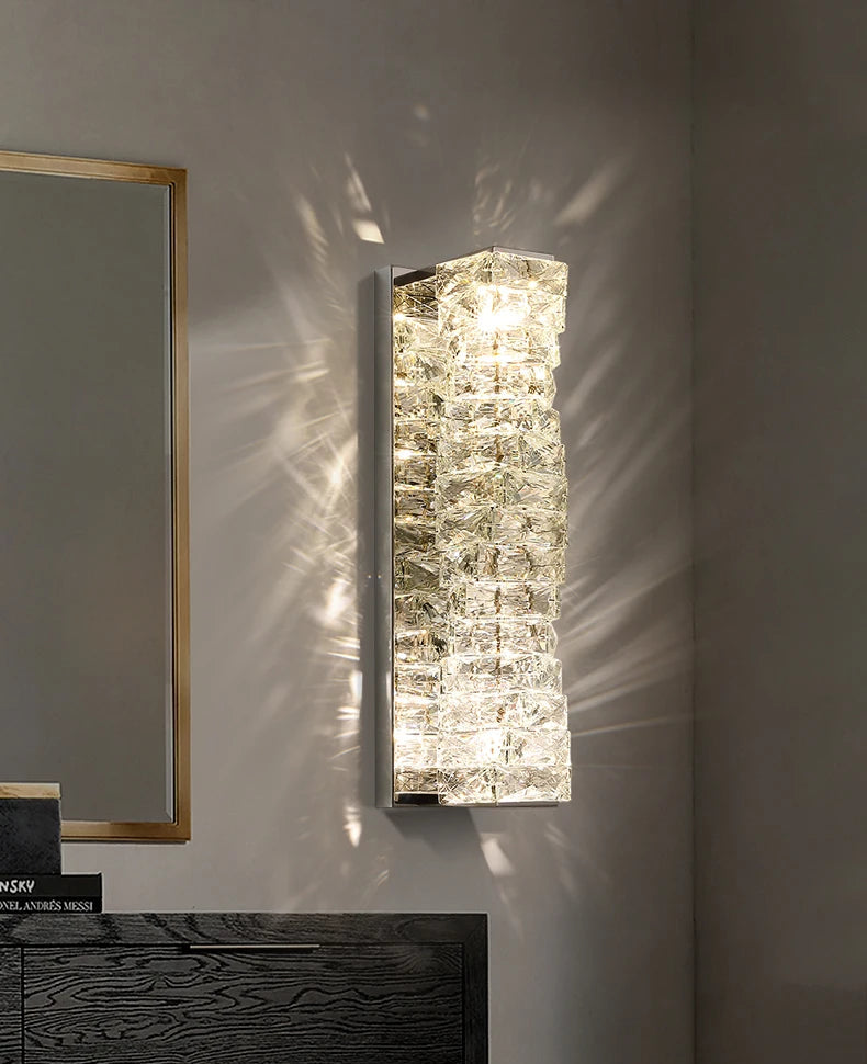 Decorative wall mirror with textured glass panel on a neutral wall.