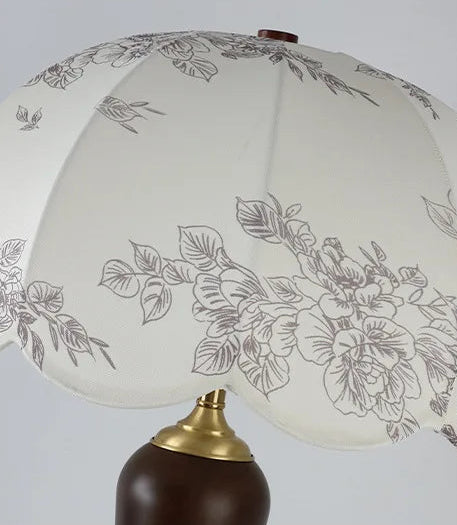 Decorative lamp with floral design on a white background