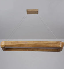 Wooden pendant light fixture on a gray background
