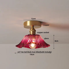 Ceiling light fixture with pink glass shade and gold copper components, labeled with dimensions and bulb information.