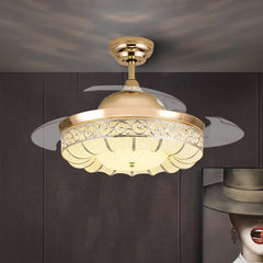 Gold ceiling fan with light fixture on a dark wall background