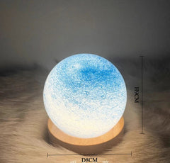 Moon lamp with dimensions on a textured surface