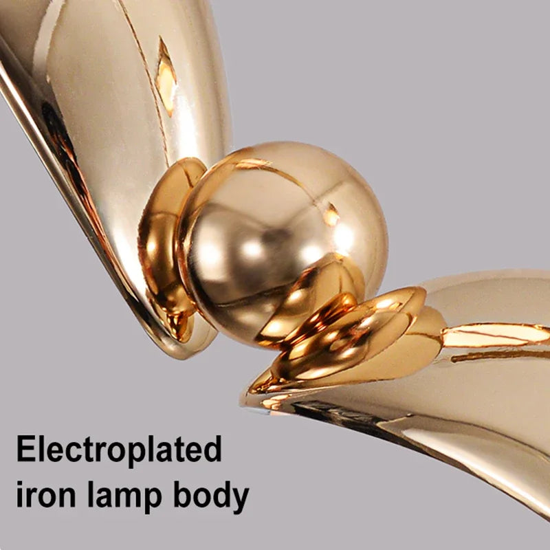 Gold electroplated iron lamp body on a gray background
