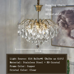 Chandelier with crystal details and adjustable hanging chain, shown indoors.