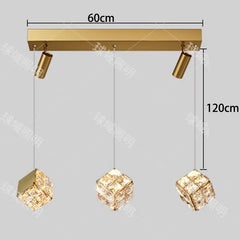 Gold ceiling light fixture with crystal shades and measurements on a gray background