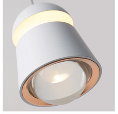 Modern ceiling light fixture with a gray and gold design on a light gray background.