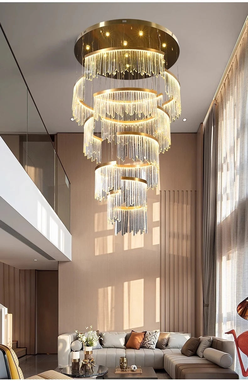 Luxurious chandelier hanging in a modern living room with a sofa and decor.