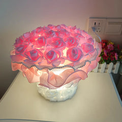 Pink floral lamp on a table with a blurred background