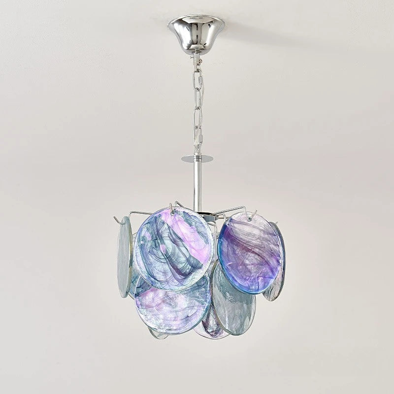 A colorful glass disc pendant light with a polished chrome chain and ceiling mount, against a white background.