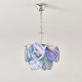 A colorful glass disc pendant light with a polished chrome chain and ceiling mount, against a white background.