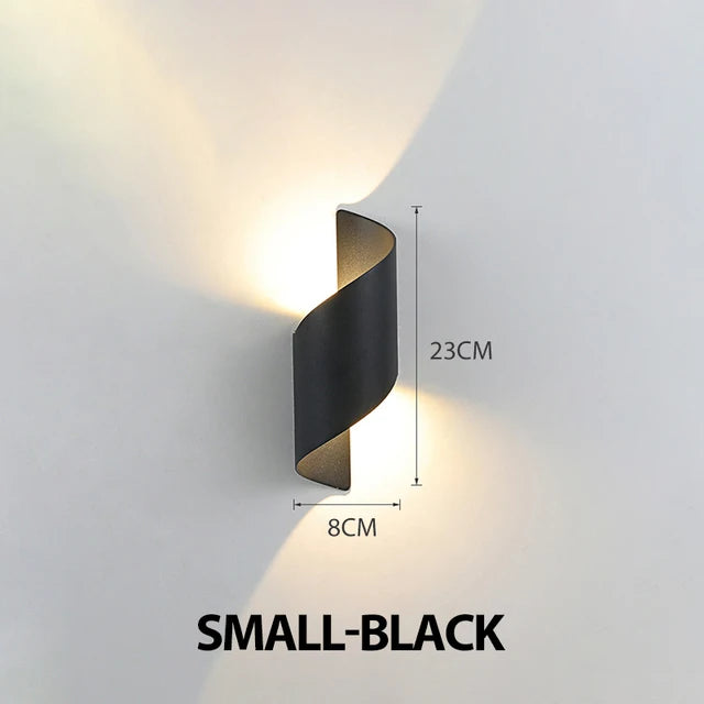 Black wall light fixture with dimensions on a gray background