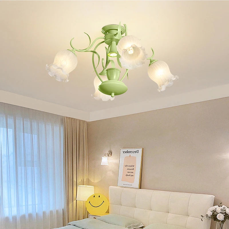 Green floral tulip semi-flush ceiling light installed in a bedroom setting above a bed