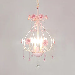 Close-up of a pink floral crystal pendant light with rose accents and cascading droplets.