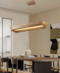 Modern dining room with a wooden pendant light fixture.