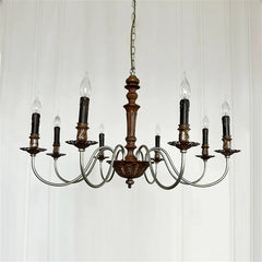 Vintage-style chandelier with wooden fixture and glass shades on a white background