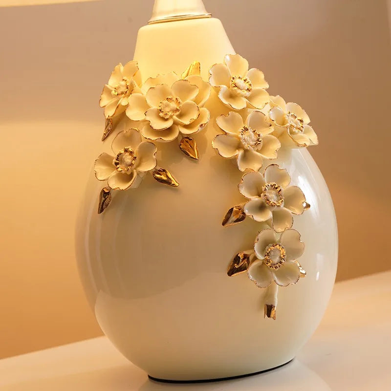 Decorative white vase with floral designs on a soft background