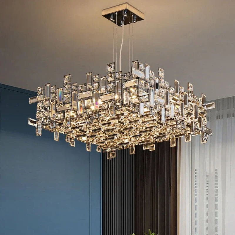 Rectangular polished chrome chandelier with multiple clear rectangular crystals arranged in a geometric pattern, hanging from a ceiling.