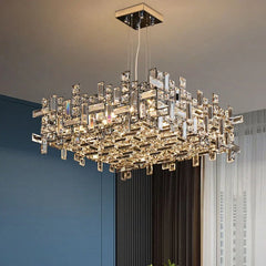 Rectangular polished chrome chandelier with multiple clear rectangular crystals arranged in a geometric pattern, hanging from a ceiling.