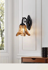Bronze Bell Glass Wall Sconce with Amber Hue and Scroll Arm