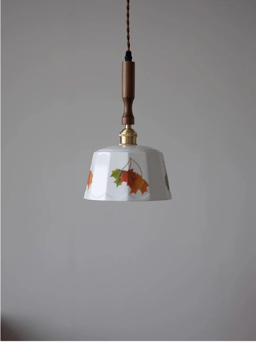 Pendant light with floral design on a plain background
